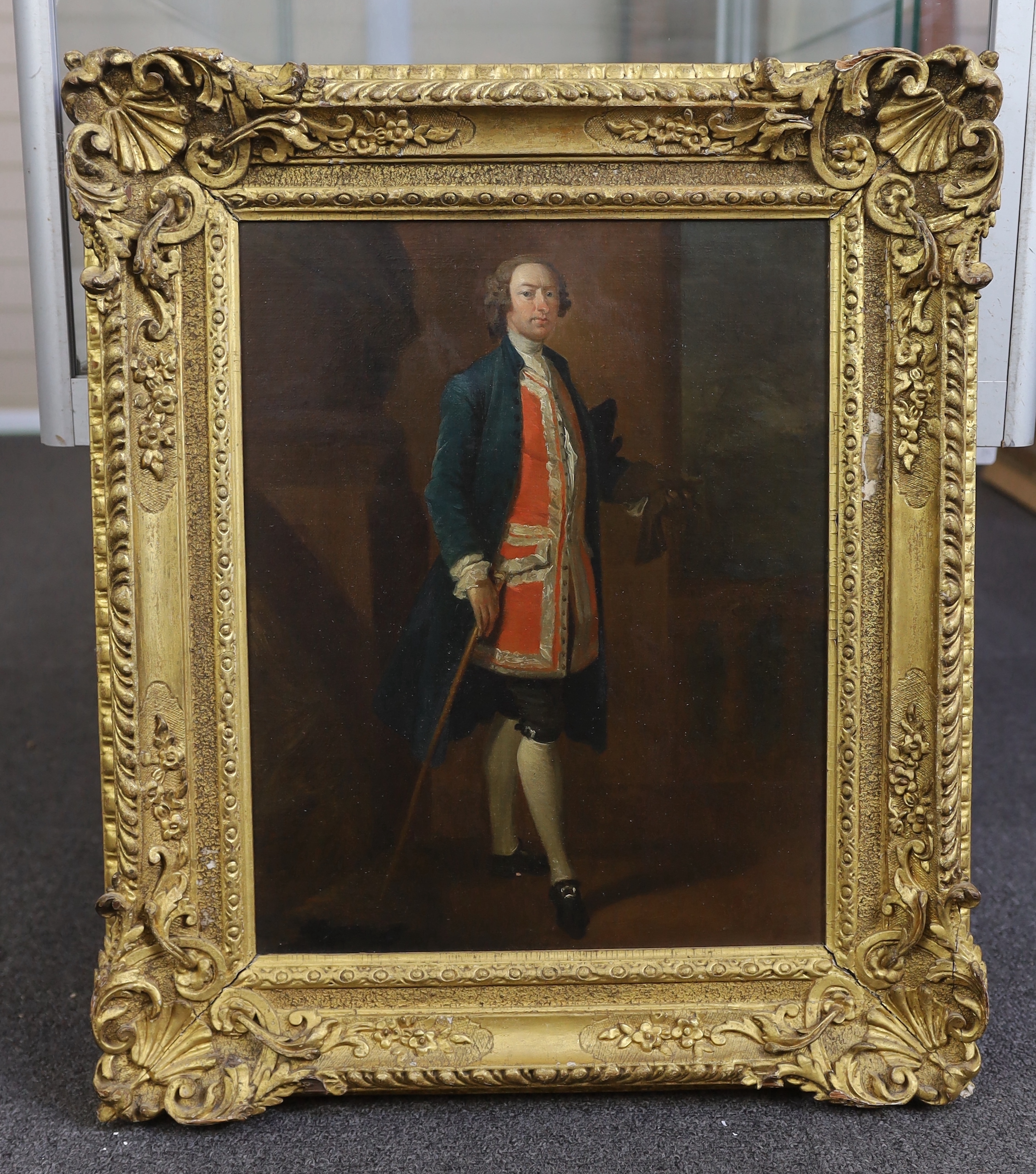 Circle of Arthur Devis (British, 1712-1787), Full length portrait of a gentleman, standing holding a cane, oil on canvas, 42 x 33cm